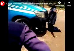 VIDEO: ‘Knock me down’, Man says as he kneels before FRSC Van in Abuja