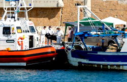 At least three migrants die as boat catches fire