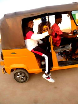 Archbishop Sam Zuga steps out on a tricycle for humanitarian services