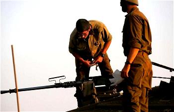 Israeli army says it hit squad placing explosives along Syria border