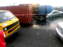 PHOTOS: Truck crushes car at Cele Bus Stop in Lagos
