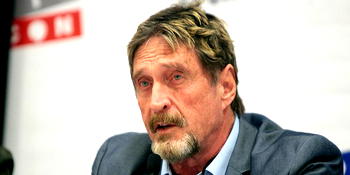 Software icon, McAfee, charged in cryptocurrency scam