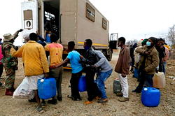 Zimbabwean shoppers rush into South Africa as borders open
