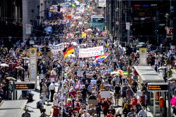 Thousands protest restrictions as Germany posts record virus numbers