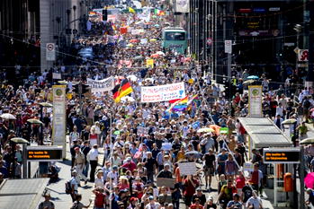 Thousands protest restrictions as Germany posts record virus numbers