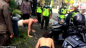 Foreigners without face masks punished with push-ups in Indonesia
