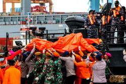 Body parts found at Indonesian plane crash site: official