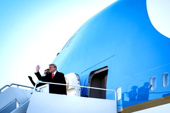 Trump leaves with snub to Biden; vows to be back