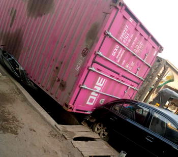 Two escape death as truck crushes car in Lagos