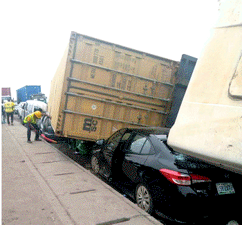 VIDEO/PHOTOS: No life lost as 40ft container, truck fall on 4 vehicles in Lagos
