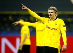 Haaland double sends Dortmund into Champions League quarter-finals