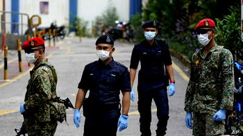 Get COVID-19 jab or leave the force, Malaysian I-G warns officers