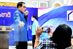 Thai PM sprays reporters with hand sanitizer