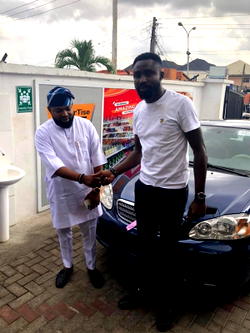 OldEnglish boss, Akogun Lanre Alfred rewards staff with Car gift