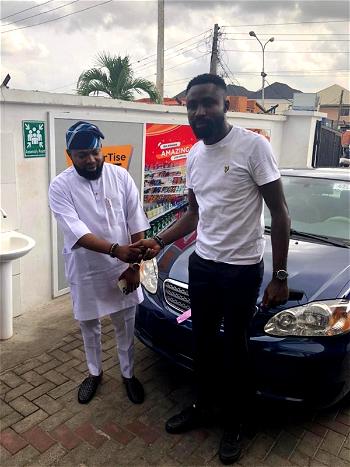 OldEnglish boss, Akogun Lanre Alfred rewards staff with Car gift