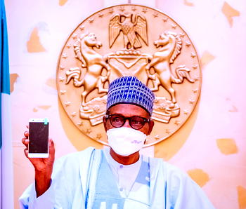 Buhari receives made in Nigeria Cell Phone