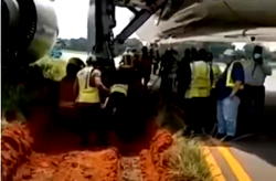 [VIDEO] Muddy Take-Off: Airplane stuck in mud at Lagos Airport