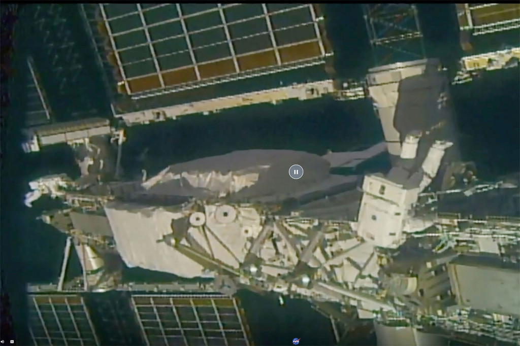 Daring astronauts install solar panels on space station