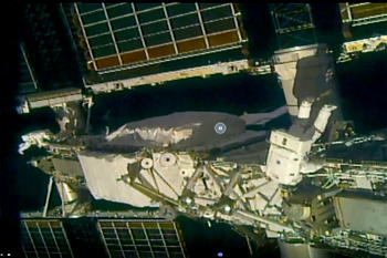 Daring astronauts install solar panels on space station