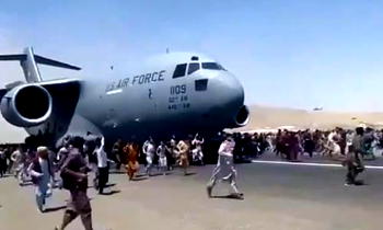 Desperation mounts at Kabul airport amid reports of Taliban reprisals