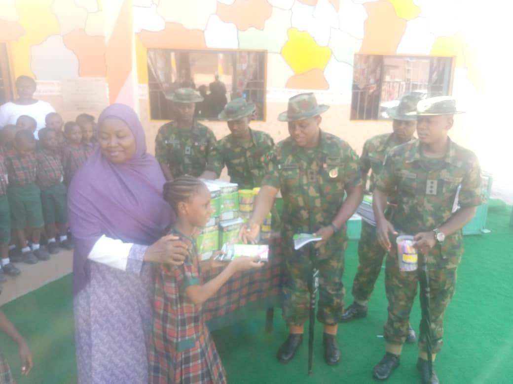 Guards Brigade conducts CIMIC to Schools in Abuja; 1,000 students get free books, pens