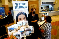 US unemployment sinks to 3.9% as many more people find jobs