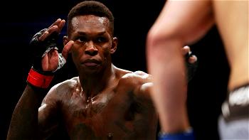 Israel Adesanya retains UFC middlewight belt with victory over Whittaker