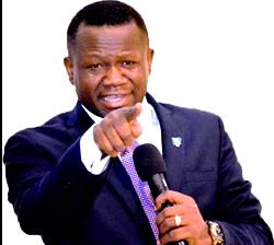 Pastor Ogbueli lights a candle at UNN
