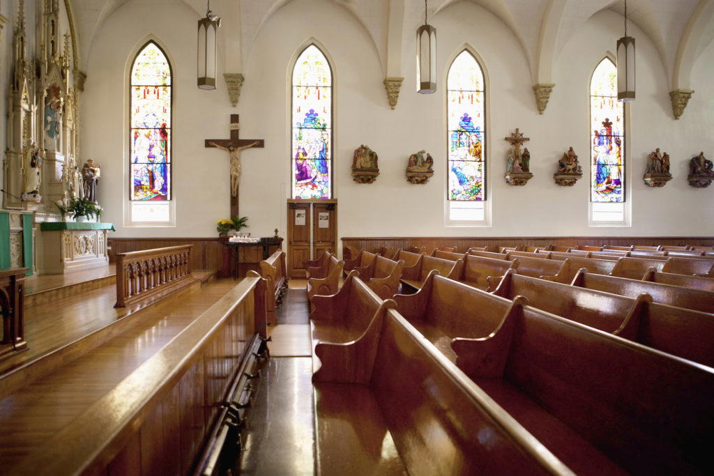 inside catholic church with people