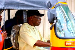 Obasanjo rides tricycle, urges youths to embrace opportunities
