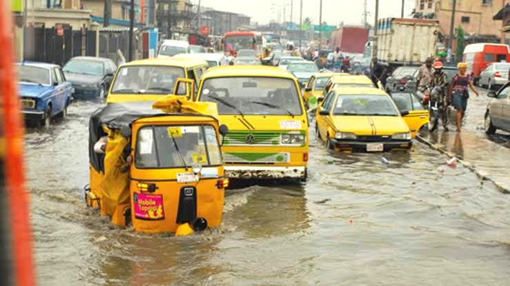 Commercial Vehicles plying through floods in Egbe-Idimu, Lagos