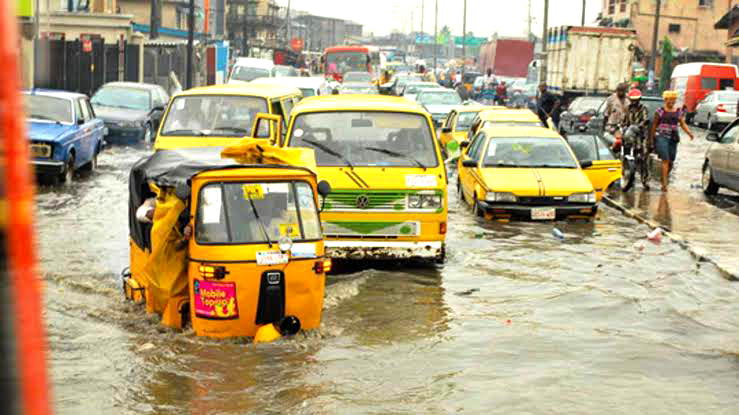 Commercial Vehicles plying through floods in Egbe-Idimu, Lagos