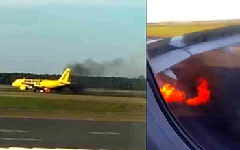 US plane catches fire on runway