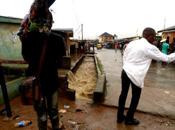 Tragedy as heavy flood sweeps away commercial bus driver in Lagos