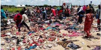 Displaced persons struggle for used clothes dumped on Maiduguri road