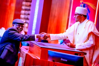 Photos: Buhari swears in Justice Ariwoola as CJN
