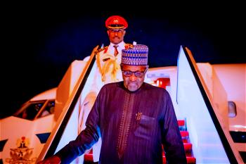 Photos: Buhari returns to Abuja after private medical trip