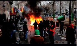 Police, protesters clash in Paris over shooting that killed three