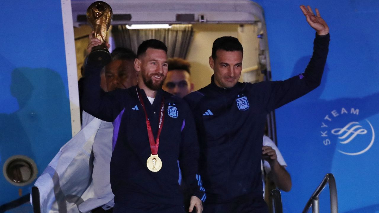 What was Lionel Messi wearing when he held aloft World Cup trophy