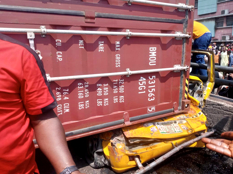 Tragedy as container-laden truck falls on commercial bus, kills 9 in Lagos