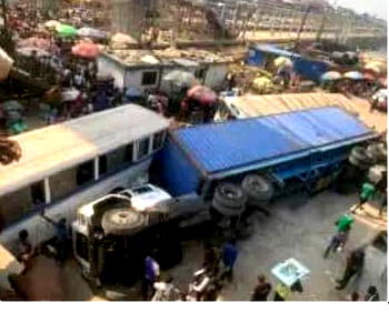 Another container falls off commercial buses in Lagos
