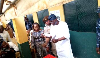 Photos: Sanwo-Olu, wife cast vote at polling units