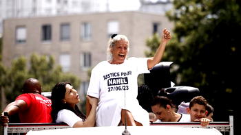 Mother of teenager killed by police leads protest in France 