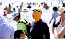 China devises new fashion apparel, Facekinis to cushion scorching  temperatures
