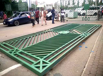 Angry protesters pull down National Assembly gate, storm premises