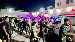 At least 100 killed as fire engulfs Iraq wedding hall