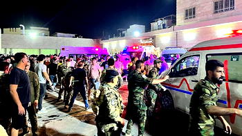 At least 100 killed as fire engulfs Iraq wedding hall