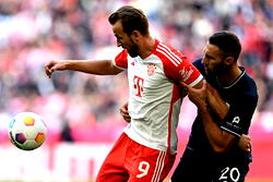 Record-setting Kane hits hat-trick as Bayern rout Bochum