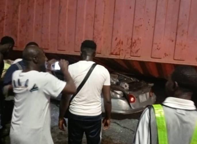 Three escape death as truck crushes car at Ojuelegba