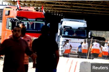 Photos: Finally, aid trucks enter Gaza from Egypt